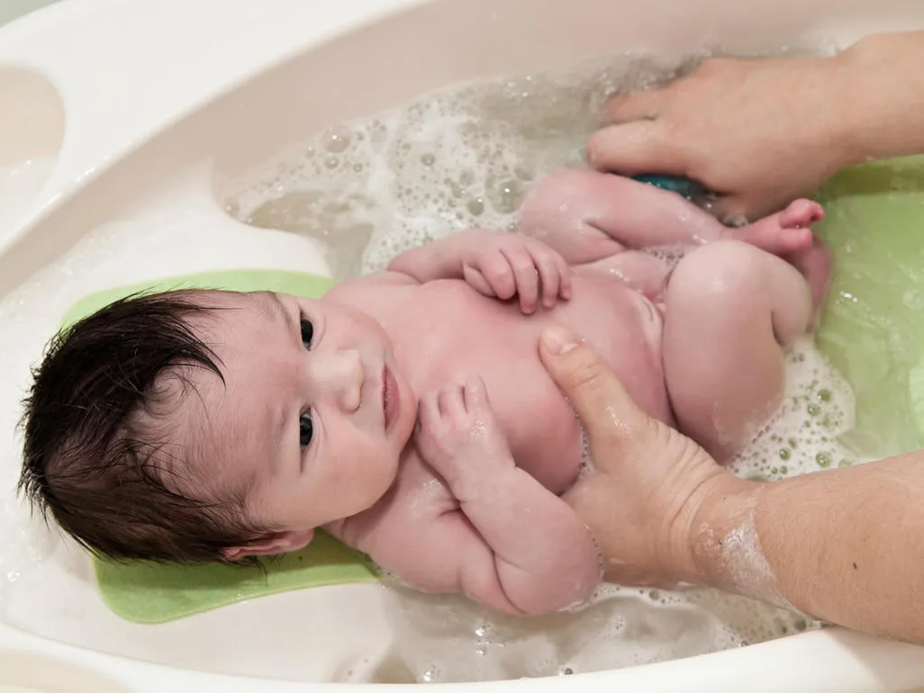 safe baby bath lying